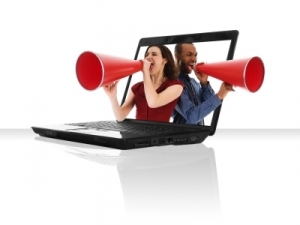 a black laptop computer with a red megaphone