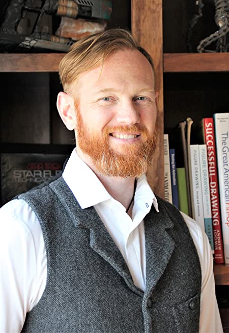 A picture of Brent Golembiewski in front of a bookshelf