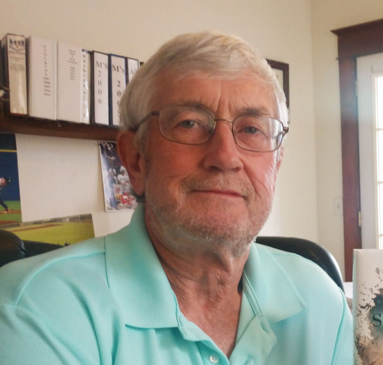 man, glasses, books, office, binders, grey hair